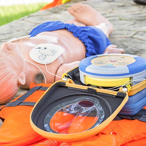First Aid dummy with defibrillator on in training