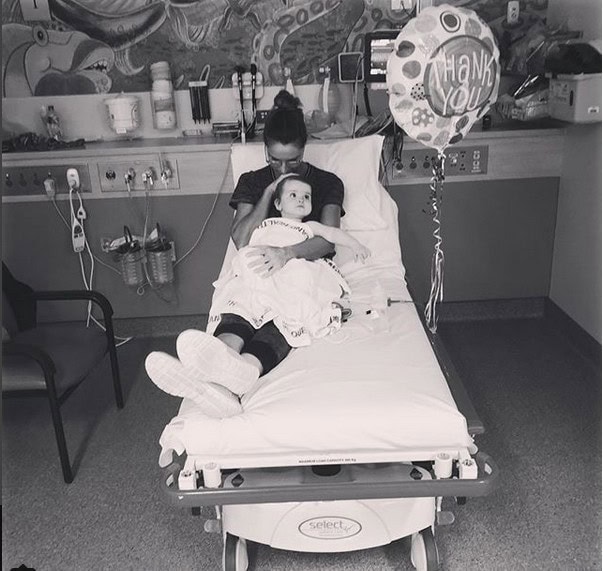 Giaan Rooney in hospital bed with daughter